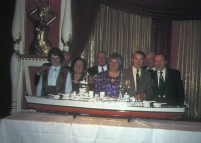 People viewing a model of H.M.S. Hood