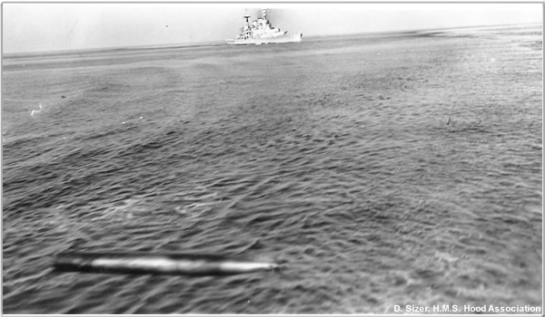 H.M.S. Hood launches a practice torpedo