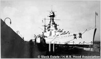 H.M.S. Hood alongside the detached mole at Gibraltar, circa 1936